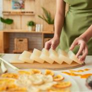 Photo of woman making bars of soap